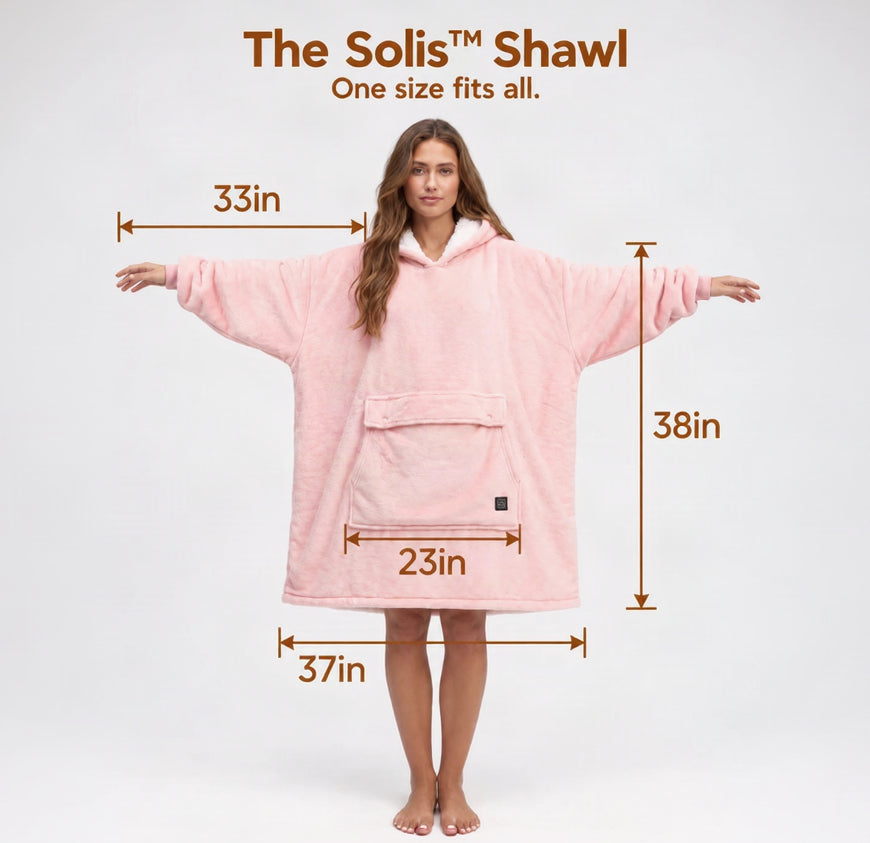 A woman stands barefoot against a light gray studio background wearing a Solrevé Solis™ pink hooded robe-style shawl with dimension arrows and labels showing 33 in width, 38 in height, 23 in front pocket width, 37 in lower width, and one arm measurement.